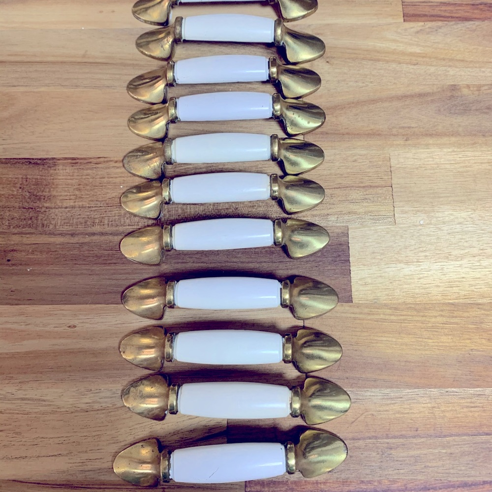 13 -Brass with white enamel drawer pulls.-Will Consider Reasonable Offers